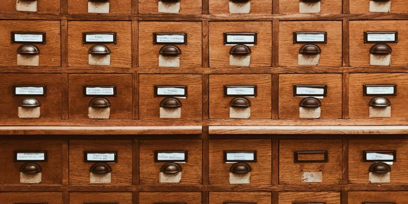 Wooden filing cabinet. Photo by Kolar.io on Unsplash